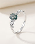 Moss agate ring in sterling silver with an oval green stone
