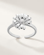 Gold daisy flower ring on an open adjustable band, on white