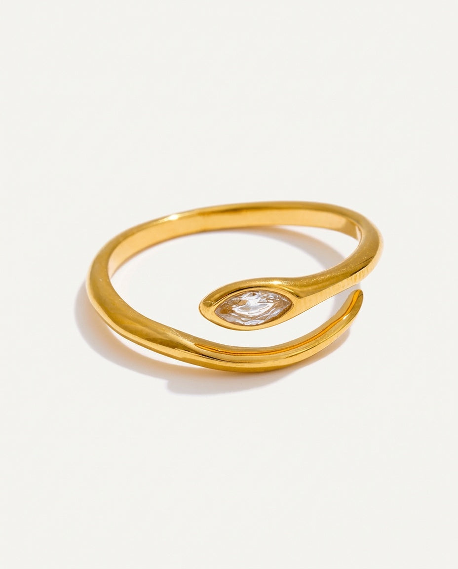 Gold snake ring with a marquise cubic zirconia head, on white
